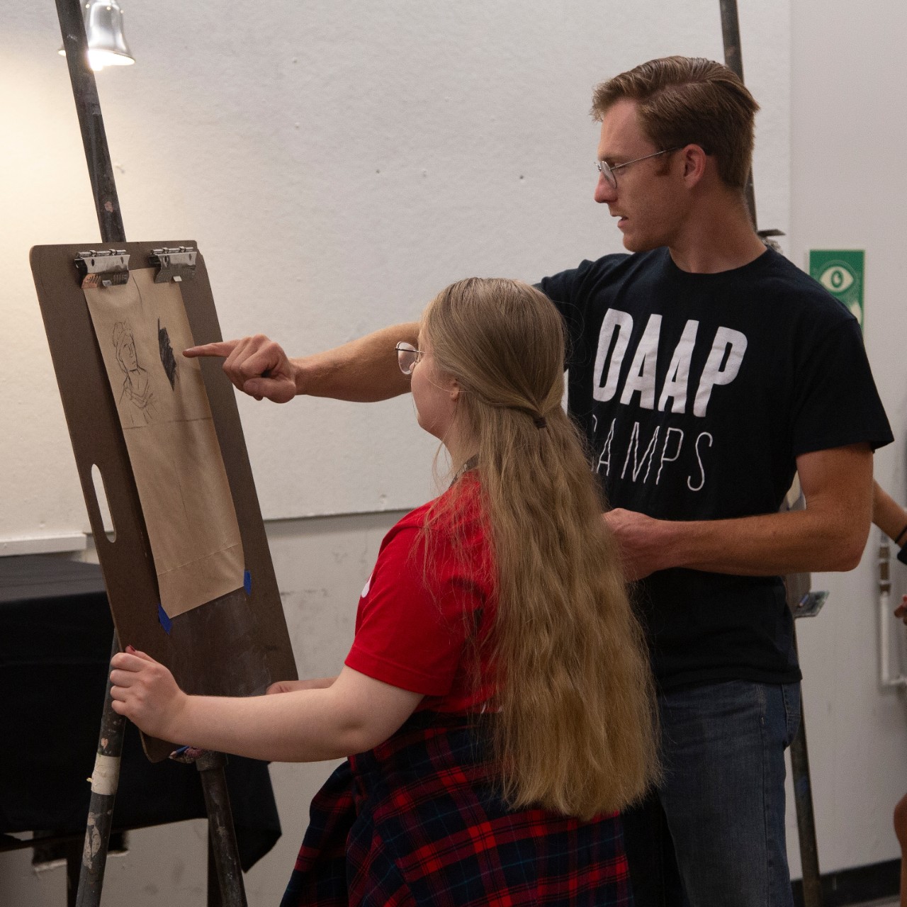 DayCamp student learning from a DAAPcamp instructor. 