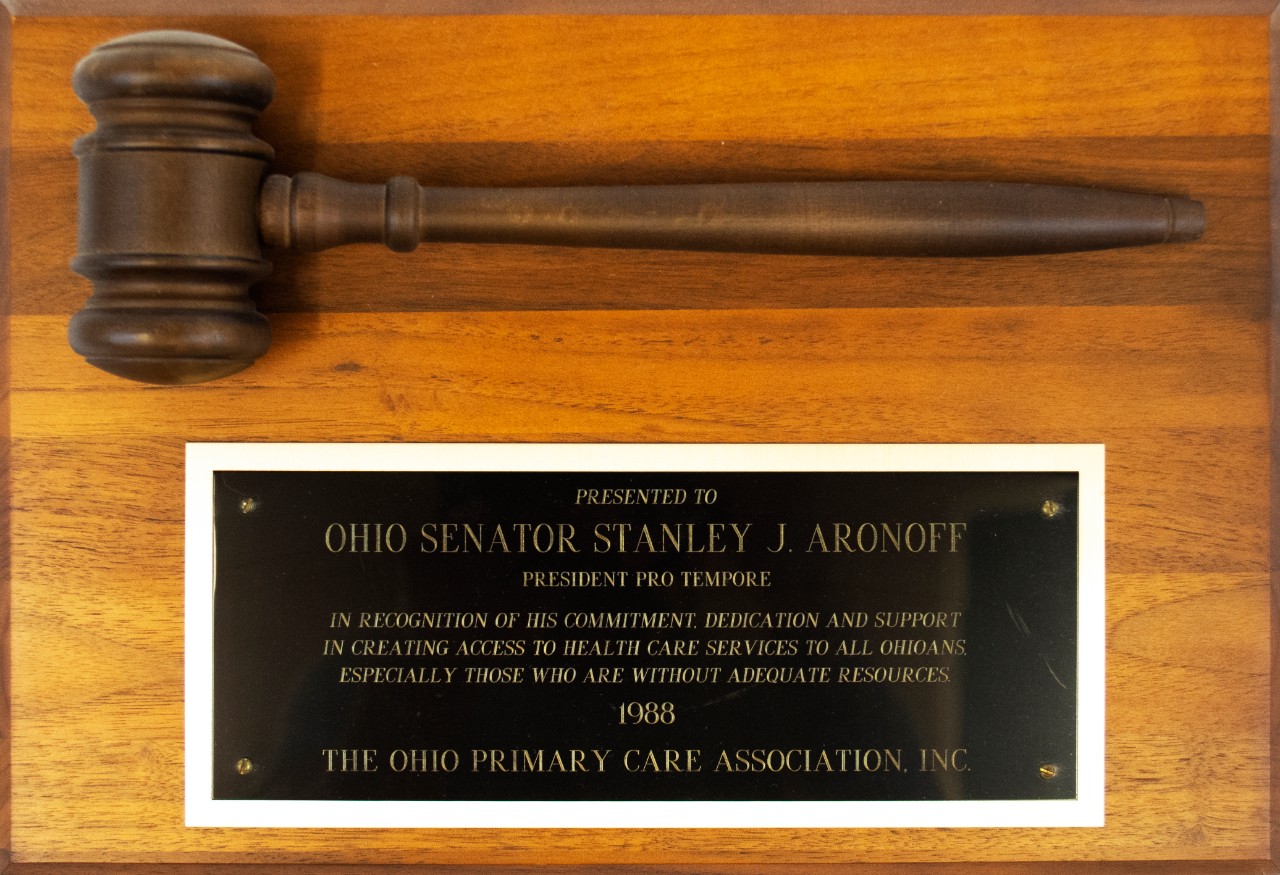 The Ohio Primary Care Association, presents an award to Stanley J. Aronoff.