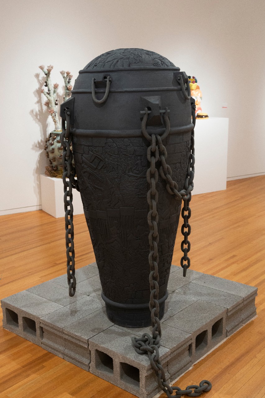 large tall gray ceramic chained tapered casket