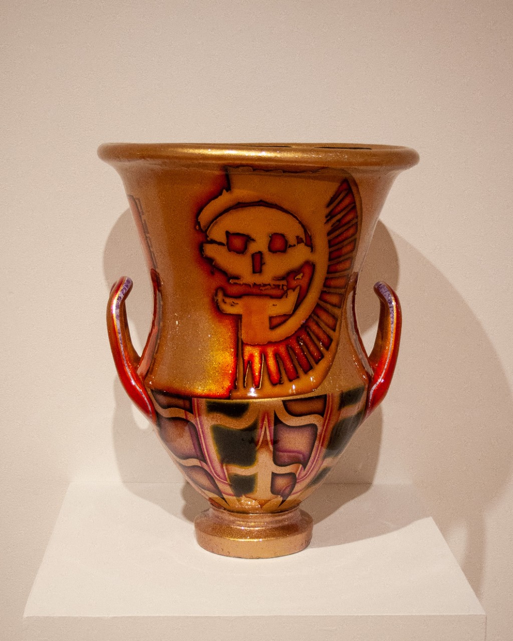 gold vase with red details