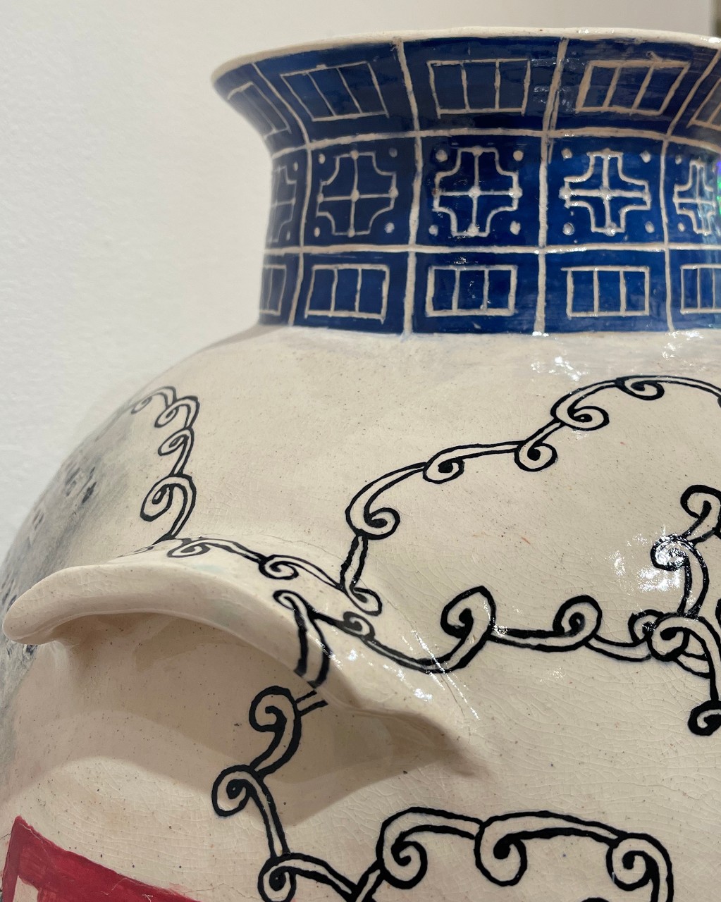 detail of face detail on vase