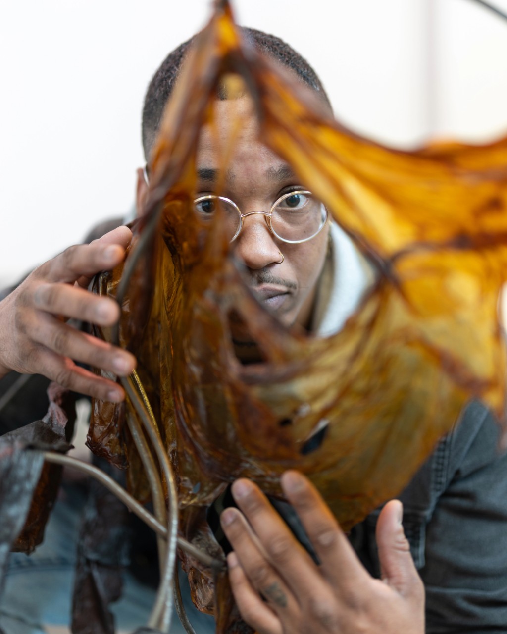 Student expressing their creativity and personality while testing a hands-on project, fully engaged in the process.