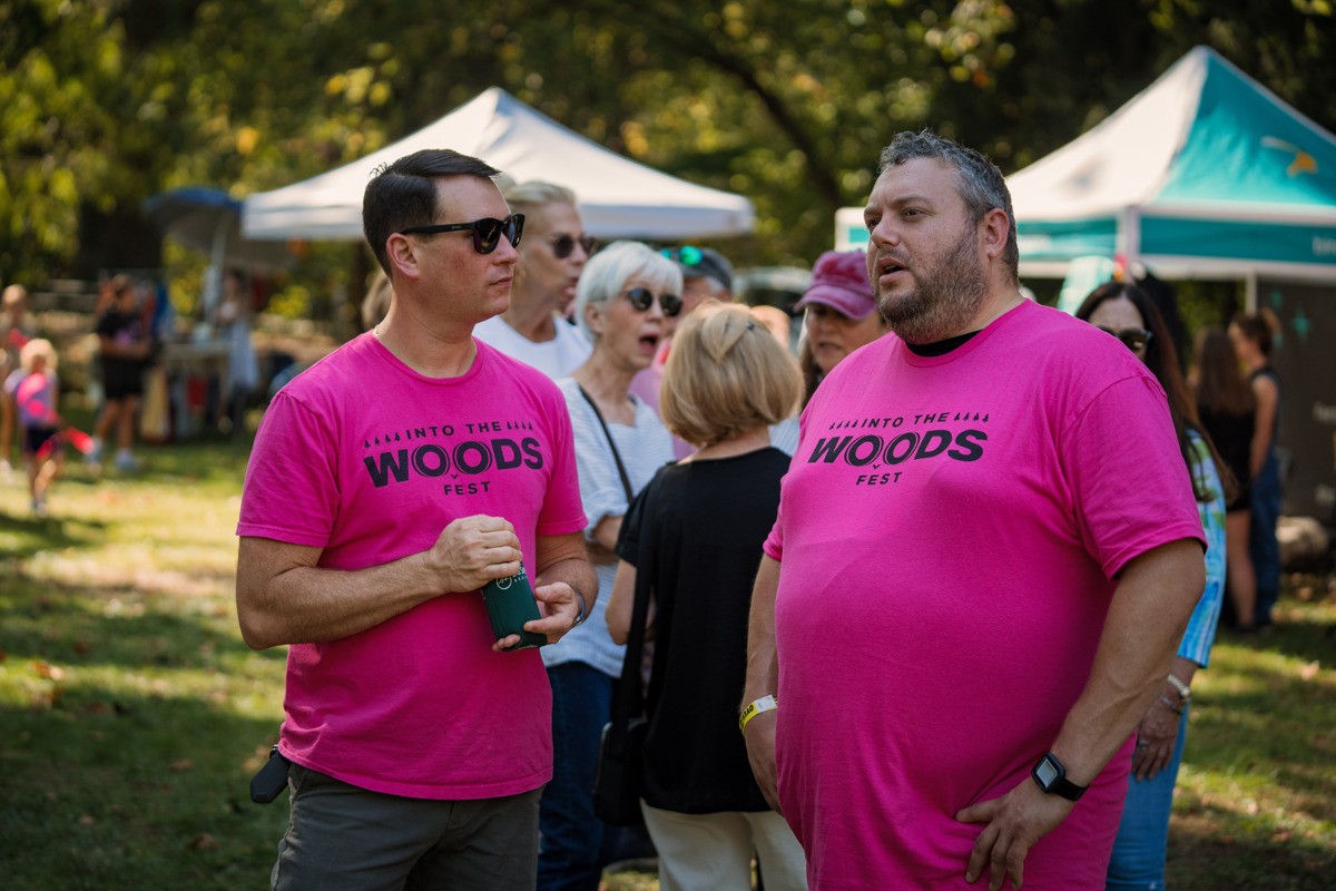 Image of volunteers talking at the Into the Woods Fest.